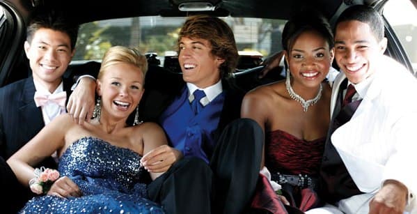 group of teens heading to a school dance in a limo