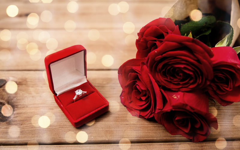 diamond ring in a red box with roses