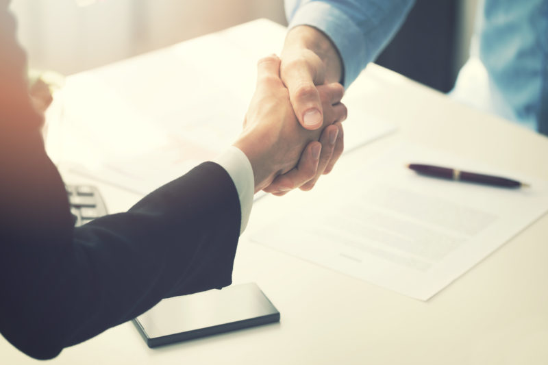 business people handshake after partnership contract signing