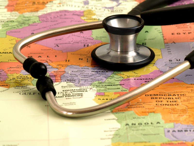 stethoscope laying over a map of africa