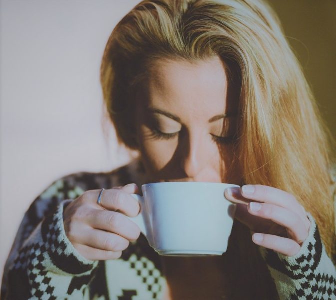 woman sipping coffee