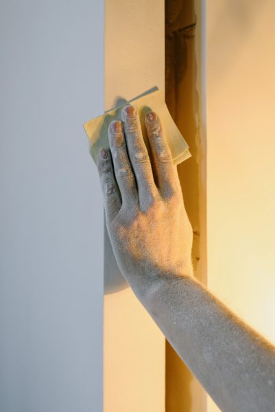 hand sanding wall