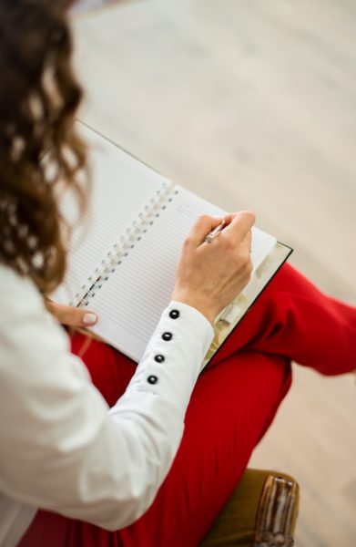 woman writing in journal