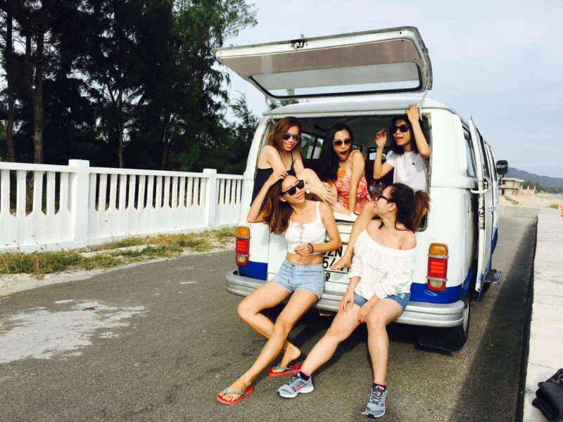 Five women in van by beach