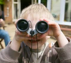blonde boy with binoculars